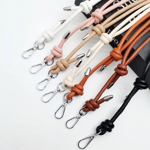 Detailed view of adjustable PU leather braided bag straps with metal lobster clasps in various colors