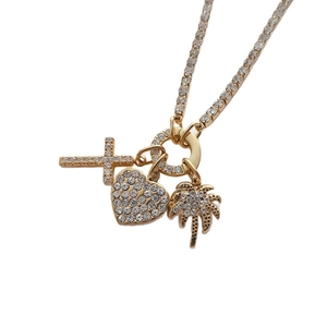 Collier chaîne tennis plaqué or 14K avec pendentifs croix, cœur et palmier en strass