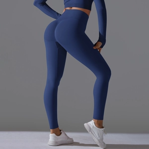 Detail of high-waist yoga set in navy blue with thumbholes and peach-lift contouring