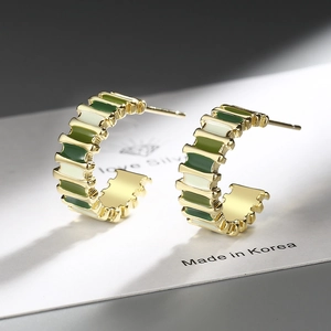 Modern C-shaped gold-plated geometric earrings with green and cream enamel stripes