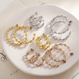 French wavy twisted hoop earrings in gold, silver, and rose gold finishes and sizes