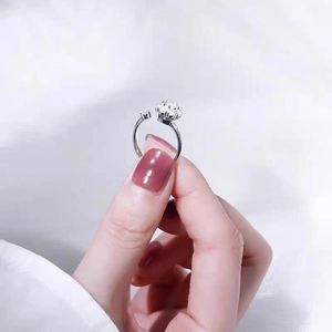 Adjustable silver spinning ring with brilliant-cut crystals and a polished finish