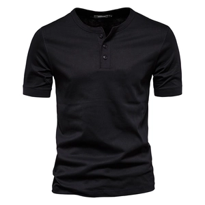 Detail of a black cotton Henley shirt featuring a classic three-button neckline and slim fit