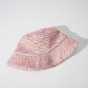 Close-up of pink and orange space-dyed mohair knit bucket hat with soft fuzzy texture