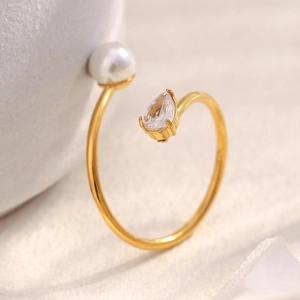 Minimalist 18K gold plated snake ring with a pearl and teardrop zircon on a neutral base