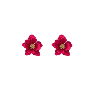 Detail of sweet floral stud earrings with deep pink layered petals and golden centers