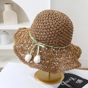 Detailed macro view of the pineapple weave on a wide brim handmade straw hat.