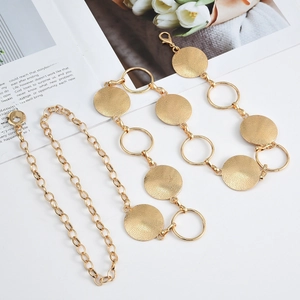 Adjustable golden metal waist chain belt with textured round discs for dresses