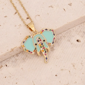 Golden elephant necklace with mint green enamel and colorful zircon stones on beige stone