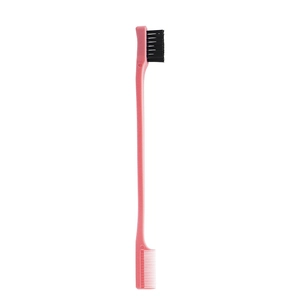 Close-up of pink double-headed edge hair brush with black bristles and fine comb teeth