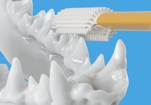 Detail of yellow 3D triple-sided pet toothbrush cleaning dog teeth in a close-up render