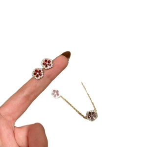 Gold plated floral jewelry set with red zircon petals and white crystal accents