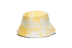 Detailed view of the yellow and white tie-dye pattern on this reversible cotton bucket hat