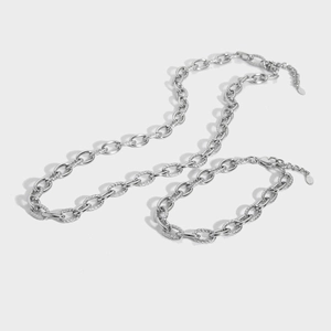 Set collana e bracciale in acciaio inossidabile con anelli lucidi e strutturati uniti