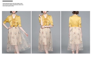Detail of yellow satin V-neck top with ruffled flowers and butterfly embroidered mesh skirt