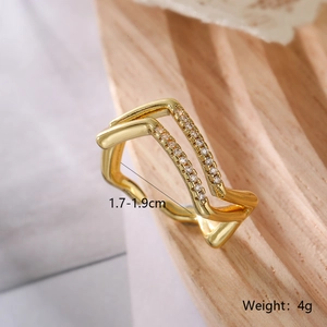 Detail of gold double-layer geometric ring with zircons showing size and 4g weight