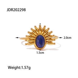 Detail view of gold-plated sunburst ring with blue lapis lazuli and size measurements