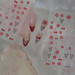 3D red floral and cherry nail art stickers with metallic accents for manicures
