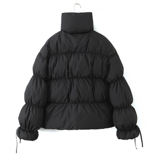 Women's black puffer jacket with stand collar and horizontal quilting, back view display