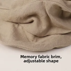 Detail of light khaki linen newsboy cap brim with built-in memory wire for styling