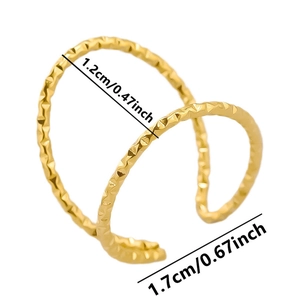 Macro detail of a gold minimalist C-shaped ear cuff with texture and size measurements