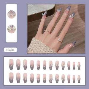 Detailed view of sparkly purple gradient press-on nails with 3D bow and 24 pieces set
