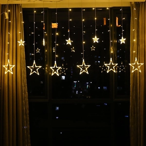 Solar powered USB star and moon curtain lights with warm yellow LED for indoor outdoor decor
