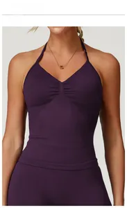 Close-up of plum purple halter yoga top featuring a deep V-neck and ruched chest detail