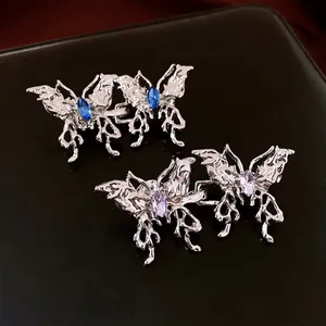 Boucles d'oreilles papillon en métal liquide argenté avec gemmes bleues et violettes