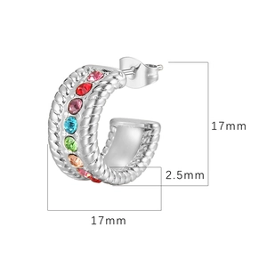 Detail view of silver C-shaped earrings with colorful rhinestones and 17mm size dimensions