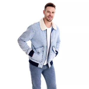 Detail of men's winter denim jacket featuring white fleece collar and ribbed cuffs
