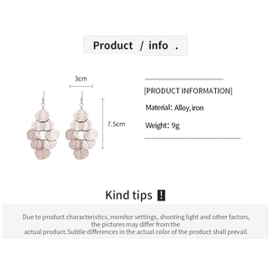 Detail view of rose gold leaf tassel earrings with size 3x7.5cm and material specs