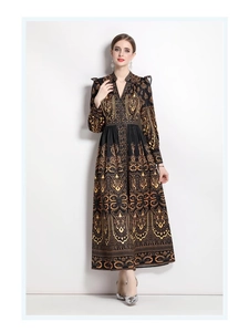 Close-up of the vintage paisley pattern and ruffled shoulder detail on this V-neck maxi dress