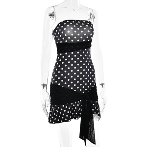 Close-up of strapless polka dot dress with mesh panels and ruffled hem detail