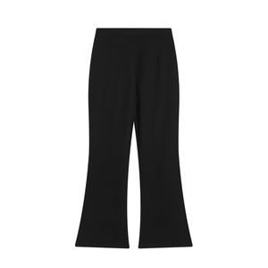 Detailed view of high-waisted black flare pants featuring elegant pleat details at the waist