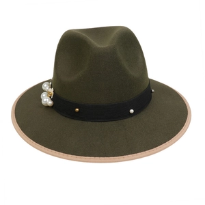 Detail of olive green wool fedora hat with pearl and metal bead accents on a black ribbon