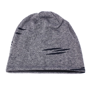 Detailed knit texture of a dark grey beanie with black claw-like streetwear patterns