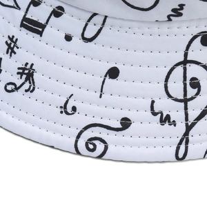 White canvas bucket hat with black music note prints and reinforced stitching details