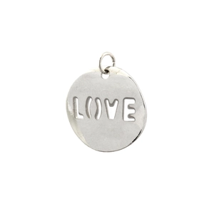 Macro shot of silver round pendant with hollow LOVE design for jewelry making
