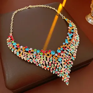 Vintage style gold necklace set with colorful crystals in a luxury leaf pattern design