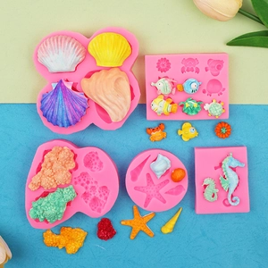 Detail of pink silicone ocean molds featuring starfish, seahorse, and coral shapes
