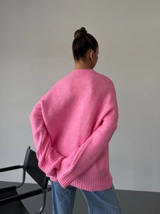 Pink oversized knit sweater with slouchy fit and round neck for a cozy autumn look