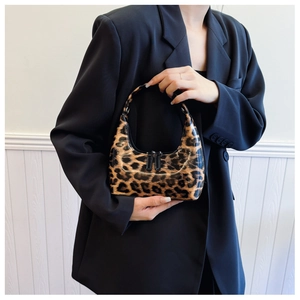 Chic leopard print patent leather hobo bag styled with a black blazer for women