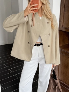 Beige collarless double-breasted jacket with wide cuffs for a casual vacation style