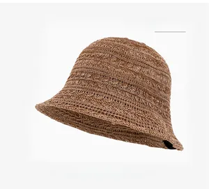 Close-up of khaki breathable woven knit texture on a women's summer sun bucket hat