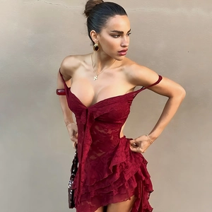 Detail view of the plunging neckline and layered lace ruffles on this red sexy mini dress