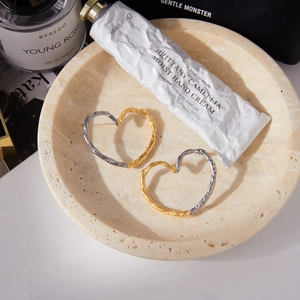 Lava texture heart hoop earrings in two-tone 18K gold and silver stainless steel finish