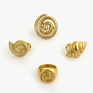 Vintage golden stainless steel rings set featuring hollow spiral and ocean shell designs