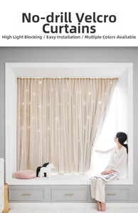 Detail of beige blackout curtain with hollow star cutouts and lace edge installation