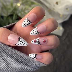 Almond press-on nails with French white tips, black polka dots and 3D ladybug design